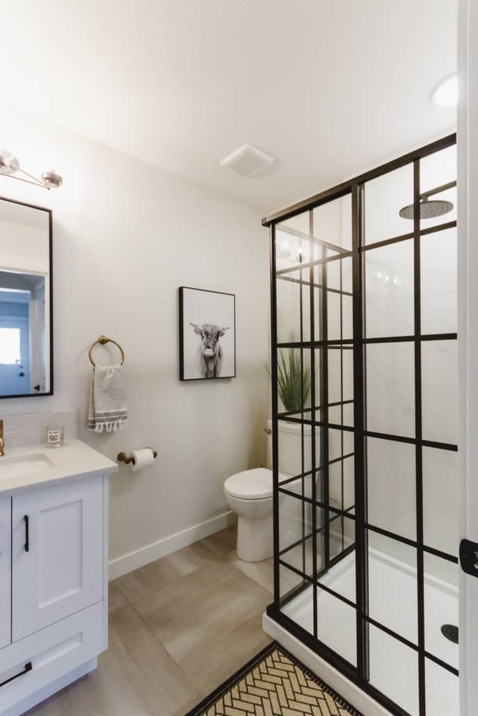 contemporary bathroom renovation black and white corner shower with custom glass