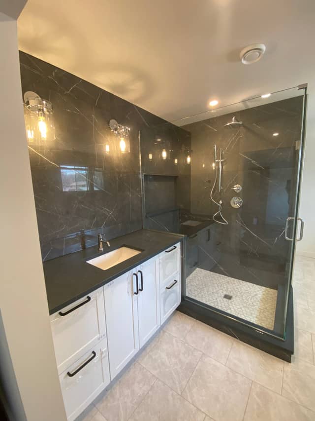 dark large format tile in trendy modern bathroom renovation