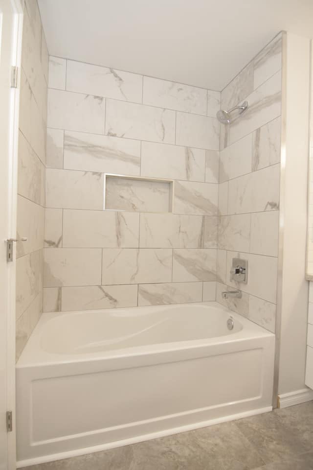 light and airy shower and tub with large carrara