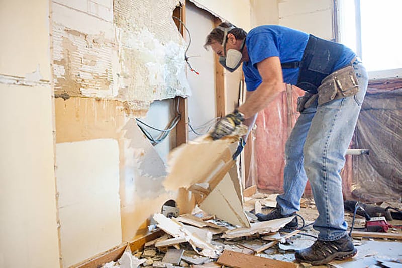 Man doing a DIY demolition project