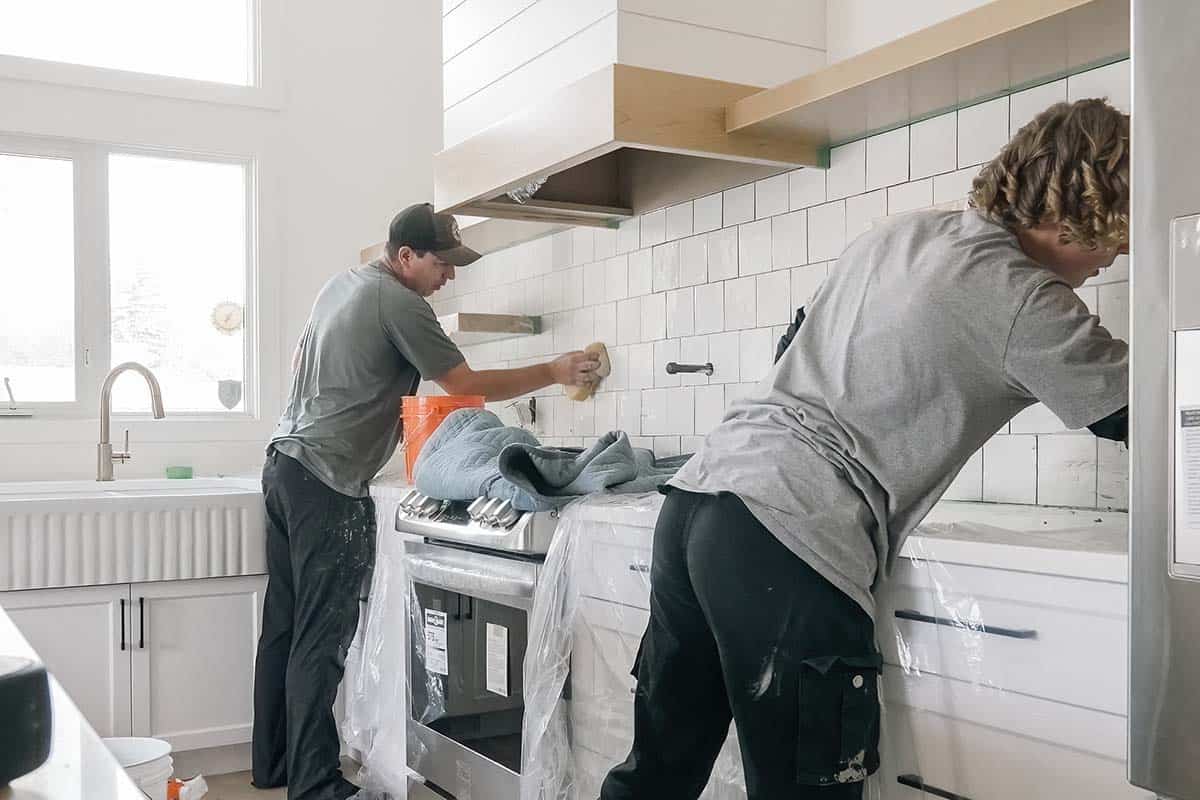 general contractor team tiling a kitchen